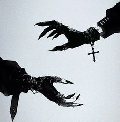 two silhouettes of hands reaching towards each other with chains on their wrists, and the sky in the background