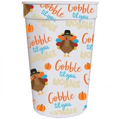 a white cup with a turkey on it and the words gobble til you, gobble