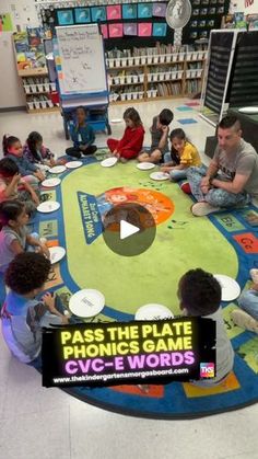 a group of children sitting on the floor in front of a giant rug with words that read pass the plate phonicic words