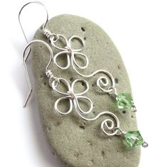 "Whimsical yet elegant earrings are handcrafted from sterling silver filled wire* and your CHOICE of genuine Swarovski crystals, as shown in last photo. These adorable earrings are inspired by the Celtic / Irish shamrock, four leaf-clover, and a multitude of dainty flowers. They would be perfect for spring, St. Patrick's Day, or any time you want to add some charming whimsy to your outfit! Earrings dangle approximately 1.6 inches (4,1 cm) long. Ships gift wrapped as shown in second to last photo Sterling Silver Crystal Earrings With Ear Wire As Gift, Sterling Silver Nickel-free Crystal Earrings As Gift, Silver Wire Wrapped Crystal Earrings As Gift, Nickel-free Sterling Silver Crystal Earrings As Gift, Silver Wire Wrapped Crystal Earrings For Gift, Gift Silver Wire Wrapped Crystal Earrings, Silver Crystal Earrings For May Birthstone Gift, Flower Earrings Silver, Shamrock Flower