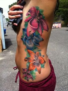 a woman's stomach with flowers on it