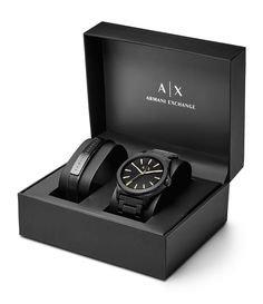 From AX Armani Exchange&#x2C; this watch features:black IP stainless steel braceletblack IP stainless steel round casematte black sunray dial with beveled index ring and gold-tone indexesquartz analog movementapprox. 44mm case size; 22mm bracelet width5 ATM water resistanceblack leather strap with logo-engraved black IP bar plaque includedImported. Watch Leather Strap, Black Leather Watch, Armani Exchange Men, Black Leather Bracelet, Watch Gifts, Luxury Watches For Men, Black Stainless Steel, Armani Exchange, Men's Accessories