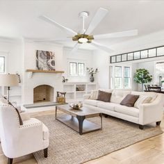 a living room filled with furniture and a fire place