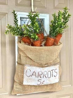 a burlap bag with carrots hanging on the front door