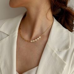 "A feminine and Parisian-styled necklace, designed with a mix of a paperclip chain and a set of organic freshwater pearls. You may place the pearls at different positions (in the center or side) to align with your outfit. Do it like a Parisienne that you will fall in love with it - Materials: 18K gold plated titanium and organic freshwater pearls - Measurements: the width of the paperclip chain is about 0.15\" / 4mm - Length: approximately 16.5\" / 42cm in total length with 2\" / 5cm extension - Elegant Pearl Necklace With Paperclip Chain As A Gift, Pearl Necklace With Paperclip Chain, Elegant Pearl Necklace With Paperclip Chain, Formal Gold-plated Necklace With Paperclip Chain, Chic Gold-tone Paperclip Chain Jewelry, Chic Gold-plated Paperclip Chain Necklace, Elegant Gold-tone Paperclip Necklace, Feminine Jewelry, Pearls Necklace