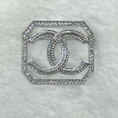 Measurements: (2 In. X 1.85 In.) All Rhinestones Are In Tact. In Fabulous Condition Luxury Rhinestone Stainless Steel Jewelry, Luxury Silver Glamorous Brooch, Chanel Necklace Silver, Luxury Silver Rhinestone Brooches, Silver Rhinestone Round Brooches, Chanel Accessories, Silver Rhinestone, Chanel, Women Accessories