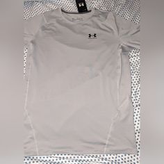 Elevate Your Workout Gear With This Brand New With Tags, Under Armour Heatgear Compression Tee. Designed For Men In Size 2xl, This Solid Gray Tee Features Short Sleeves, A Crew Neckline, And A Pullover Closure For Ease Of Wear. The Lightweight, Moisture Wicking And Breathable Fabric Make It Perfect For All Seasons. This Under Armour Tee Also Boasts Moisture-Wicking Technology To Keep You Dry And Comfortable. The Collarless Design, Stretch Material, And Tagless Feature Add To The Modern And Sleek Under Armour Fitted Moisture-wicking Tops, Fitted Under Armour Moisture-wicking Top, Basic Gray Moisture-wicking Tops, Under Armour Relaxed Fit Crew Neck Top, Casual Crew Neck Top By Under Armour, Under Armour Crew Neck Moisture-wicking T-shirt, Under Armour Moisture-wicking Crew Neck T-shirt, Under Armour Crew Neck Top, Under Armour White Moisture-wicking Top