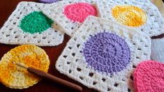 crocheted coasters are arranged on a table