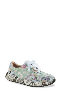 A flowery design makes sure you stand out in a hand-painted sneaker grounded by a sporty sole covered in a newspaper print. This statement-making kick is fitted with a cushy, arch-supporting footbed for endless comfort. 1 1/2" heel Cushioned footbed with arch support Synthetic upper/textile lining/rubber sole Imported Multicolor Floral Print Slip-on Sneakers, Sporty Floral Print Sneakers With Round Toe, Floral Print Round Toe Sneakers For Spring, Spring Floral Print Sneakers With Round Toe, Spring Floral Print Round Toe Sneakers, Sporty Floral Print Sneakers For Streetwear, High-top Floral Print Sneakers For Spring, Floral Print Sneakers For Spring Streetwear, Spring Floral Print Sneakers For Streetwear