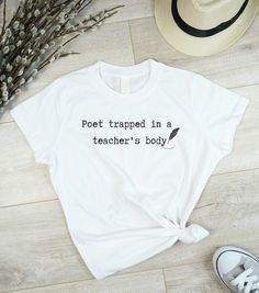 🖋️ Express Your Unique Identity with a Personalized 'Poet Trapped in Your Profession's Body' T-Shirt! 🎨 Looking for a way to blend your passion for poetry with your profession? Our TTPD Poet Shirt is the perfect choice! Personalize it with your desired trade or profession and make a statement that's uniquely you. ✨ Why Choose Our T-Shirt? ✨ 👕 Classic Comfort: This unisex jersey tee fits like a well-loved favorite, with ribbed knit collars and tapered shoulders for a better fit over time. Dual Poet Shirt, Eras Tour Outfit, Sustainable Style, Jersey Tee, Eras Tour, Clothes Gift, Leisure Wear, Shirt Price, Sustainable Fashion