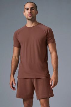 The Triumph Crew Neck Tee - Chestnut | Alo Yoga Versatile Moisture-wicking Crew Neck T-shirt, Versatile Crew Neck Sports T-shirt, Casual Alo Yoga Tops For Loungewear, Alo Yoga Casual Loungewear Top, Alo Yoga Relaxed Fit Cotton Top, Solid Casual T-shirt For Workout, Sporty Brown Short Sleeve T-shirt, Casual Solid Workout T-shirt, Alo Yoga Relaxed Fit Athleisure Top