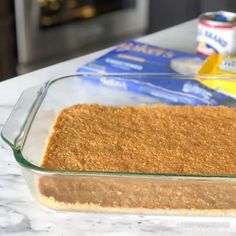 a glass baking dish filled with food on top of a counter