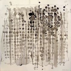 black and white painting with lots of circles on it's surface, in the middle of