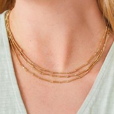 This Mermazing Necklace wraps your neck in three layers of mesmerizing tiny metal beads. Designed to shine through everyday wear, exercise, showers and a summer at the beach in tarnish free 14kt gold vacuum plating. This is a necklace you will never have to take off. Details: Lobster clasp closure Length: 17'' L with 2'' extension Tarnish free & water resistant 14kt shiny gold vacuum plating over stainless steel Gold Necklace Layered, 14kt Gold, Metal Beads, Layered Necklaces, Custom Items, Sale Items, Everyday Wear, Gold Necklace, Plating