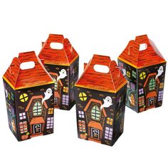 three halloween treat boxes in the shape of houses