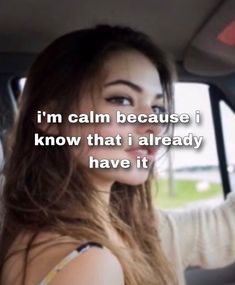 a woman sitting in a car with the words i'm calm because i know that i already have it