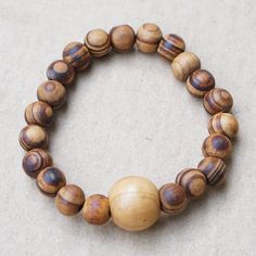 Wear the warm and serene essence of the forests with a dapper design by Eliasu Adams from Ghana. The artisan uses sese wood beads featuring a natural grain pattern to create this stretch bracelet that adjusts to your size for extra comfort. Cord Wood, Recycled Glass Bead, Gift Suggestions, Buy Wood, Glass Beaded Bracelets, Classic Jewelry, Sentimental Gifts, Beaded Stretch Bracelet, Jewelry Packaging