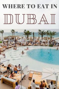 people sitting at tables in front of an outdoor pool with the words where to eat in dubai