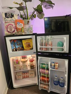 an open refrigerator with its door wide open and filled with food, drinks and condiments