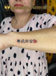 a woman with a tattoo on her arm that says, i am a star and two hearts