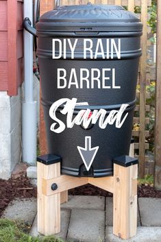 a black barrel with the words diy rain barrel stand on it