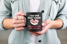 a woman holding a black coffee mug with the words gaming is just like normal dad except better