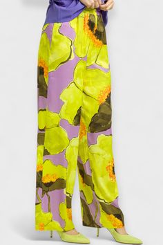 Effortlessly elevate your wardrobe with these stunning Orchid Floral Satin Palazzo Pants, made in Italy from silky viscose in vibrant lime green and lavender floral prints. Enjoy the luxurious high-rise fit and banded elasticated waist, with a wide leg design that is both comfortable and stylish. Pair with our Lilac Peplum blouse for a unique and elegant look, or go for a monochromatic chic ensemble with our Orchid Sheer Blouse and Orange T-Strap Heels. These pants are a must-have for any fashio Satin Palazzo Pants, Green And Lavender, Lavender Floral, T Strap Heels, Peplum Blouse, Pants Large, High Rise Pants, Leg Design, Wide Pants