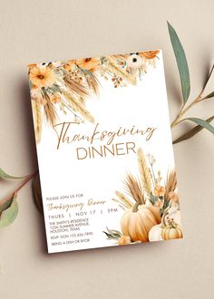 a thanksgiving dinner card with pumpkins, flowers and leaves on the front is shown