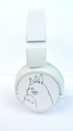 a white headphone with a drawing of a totoro face on it's side