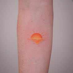 the sun is shining brightly on someone's left arm and it appears to be orange