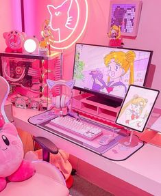 there is a pink desk with two computers and a teddy bear sitting on the chair