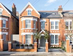 a large red brick building with white trim