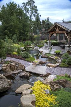 a garden with rocks and water in it