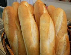 several loaves of bread sitting in a basket