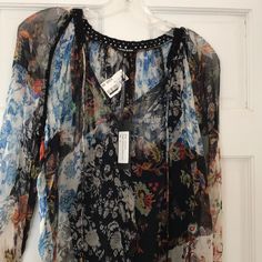 Flowy Floral Bohemian Blouse Spring Bohemian Silk Tops, Bohemian Sheer Blouse For Summer, Spring Silk Tunic Blouse, Silk Tunic Blouse For Spring, Spring Bohemian Silk Blouse, Bohemian Blouse With Blouson Sleeves In Multicolor, Bohemian Silk Blouse For Spring, Flowy Silk Blouse For Spring, Spring Boho Print Tunic Blouse