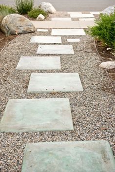 a walkway made out of stones and gravel