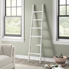 a ladder leaning against the wall in a living room