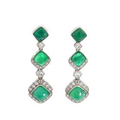 Your energy is contagious, bringing so much light and life into the world! You are the perfect soul to wear these beautiful handmade platinum sugarloaf emerald and diamond earrings! 4 French cut diamonds 0.38 ctw 42 old mind cut diamonds 0.75 ctw 6 emeralds 6.92ctw measurement: 37mm by 11mm by 7 mm CONFIDENCE GUARANTEE: These antique components have stood the test of time and have lasted for many decades - many even centuries! Before they land in our studio, our goldsmith ensures they are in perfect modern condition. Every mounting has been inspected, every stone has been secured and every prong has been perfectly fitted so that these antique pieces of art are strong for everyday modern wear. For pieces over $3000, we offer independent appraisals so you can be confident of the authenticity Green Brilliant Cut Diamond Earrings, Formal Emerald Earrings With Diamond Accents, Emerald Cut Diamond Earrings For Formal Occasions, Green Diamond Earrings With Diamond Accents, Emerald And Diamond Earrings, Modern Wear, Unique Bridal Jewelry, Big Statement Earrings, Glam Earrings