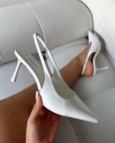 These white sling black court shoes are a work of art. Featuring a pointed toe and a slingback. With our sling back court shoes, you'll be prepared for any event, from glamorous nights out to productive days in the office. - Heel measures approximately 3 inches/ 8 cm- Faux leather upper- Model wears UK 6 / EU 39 / US 8- Fits true to size Black Heels With Wedding Dress, Graduation Shoes Heels Classy, Heels For White Dress, White Pointed Toe Heels, White Sling Back Heels, White Slingback Heels Outfit, White Heels Graduation, Shoes For White Dress, White Heels Classy