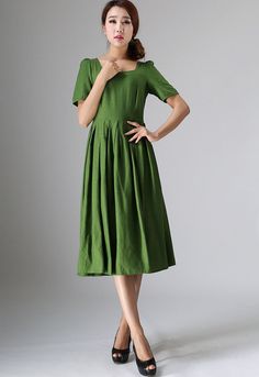 "This Prairie Linen dress is designed with soft linen in forest green hues, perfect with Puff sleeve, round neckline, and back button closure, This womens swing dresses can be styled with light weight a accessories for a daring ensemble . vintage inspired design, Handmade by Xiaolizi. DETAILS 50% linen, 50% Cotton, Medium weight Linen No lining Square neckline Short Puff Sleeve Seam pockets Back Zipper Below Knee length Spring, Summer House dress More color and More size https://etsy.me/2TGUAgq Dark Green Short Sleeve Dresses For Spring, Dark Green Short Sleeve Midi Dress For Spring, Casual Green Midi Dress With Pleated Waist, Casual Dark Green Short Sleeve Dress, Fitted Green Linen Dress, Green Spring Dress With Pleated Hem, Spring Green Dresses With Pleated Hem, Green Linen Dress Solid Color, Green Pleated Hem Dress For Spring