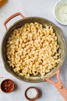 macaroni and cheese in a pan next to other ingredients