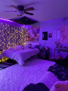 a bedroom with purple lights on the walls