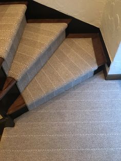 a carpeted stair case is shown in this image