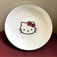 a white bowl with a hello kitty design on it