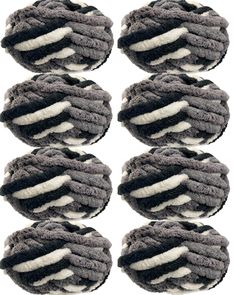 six pieces of black and white yarn on top of each other in the shape of circles