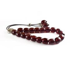 "Handcrafted Komboloi - Worry Beads made of high quality acrylic beads in burgundy color and silver tone metal Master Bead. This durable and pocket sized Komboloi is ideal for everyday use for passing time and relaxation. It would also be great for gift giving. Item can be made with different cord color. Please choose the cord color you would like from the drop down menu. Features: Item Length: approx. 26cm / 10\" Bead Size: 13x13mm / 0.50x0.50\" Bead Type: Acrylic Bead Color: Burgundy - Dark Re Adjustable Polished Amber Beads, Worry Beads, Popular Necklaces, Red Bead, Prayer Beads, Burgundy Color, Necklace Sizes, Acrylic Beads, Metal Beads