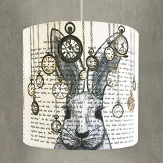 a lampshade with an image of a rabbit wearing clocks on it's head