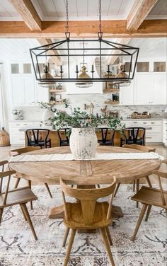 a dining room table with chairs around it