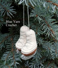 a knitted ornament hanging from a tree with the words blue yarn crochet on it