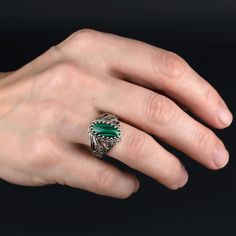 Malachite 925 Silver Cocktail Ring Artisan Made Handcrafted Filigree Art Angel Statement Ring Ring Face Length is 0.65 inches and Width is 0.30 inches Natural Malachite Gemstone is 7X14 mm oval cabochon cut. This metal embroidery filigree ring is oxidized and highly polished. Comes with velvet pouch and luxurious gift box. Filigree is made of delicate metal strands that have been skillfully fashioned to create an outstanding combination of old and modern art. Originating in Mesopotamia, Anatolia Silver Malachite Gemstone Ring, Green Intricate Design Jewelry Ring, Green Intricate Design Ring, Silver Malachite Rings As Gift, Handmade Silver Malachite Rings, Silver Round Malachite Jewelry, Green Sterling Silver Jewelry With Intricate Design, Handmade Malachite Ring Jewelry, Handmade Malachite Ring